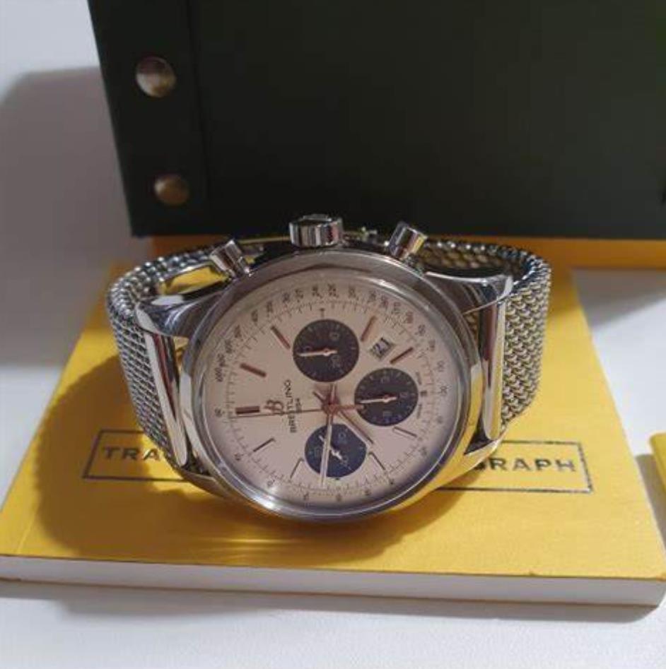 The silvery dial fake watch has a date window.